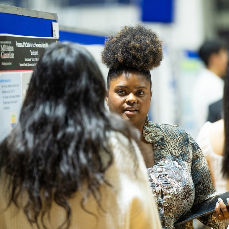 McMurtry College senior Ariah Richards presenting her work at Rice's Natural Sciences Undergraduate Research Symposium April 11, 2024