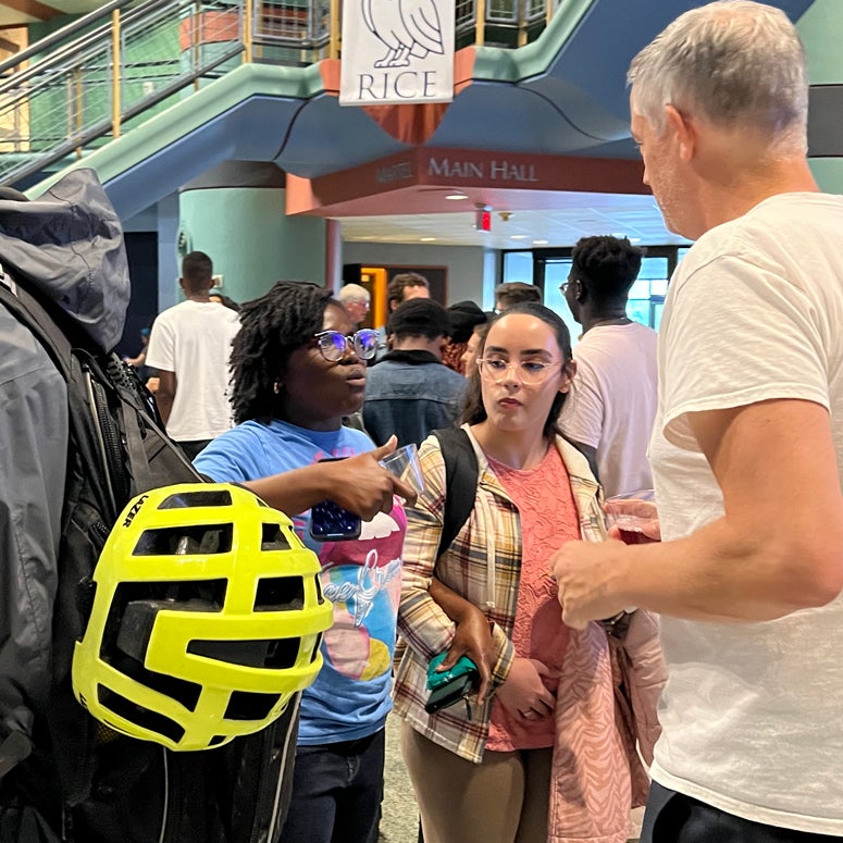 Students speak with a professor at a May 31 welcome reception for 180 undergraduates who are working this summer in research programs in Rice laboratories